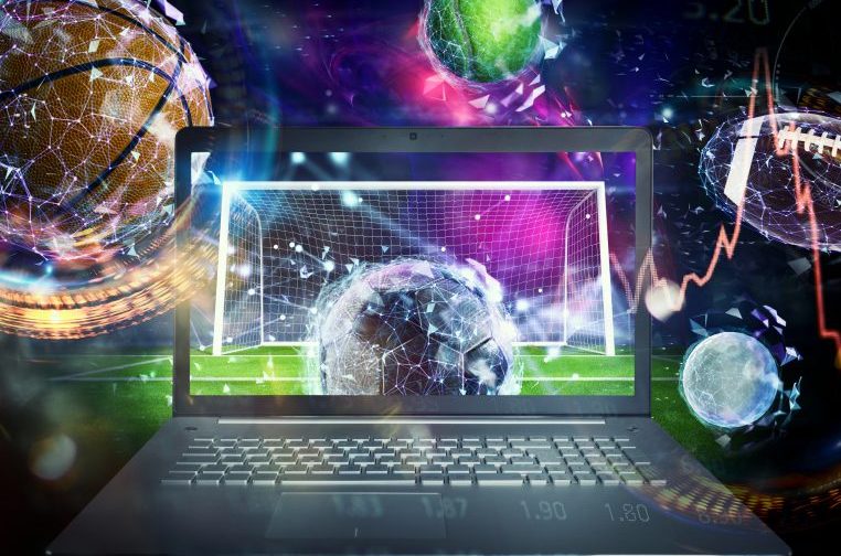 Arte com um computador, um gol, e várias bolas